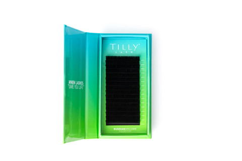 Faux mink eyelashes in a blue and green box sitting on a white background. 