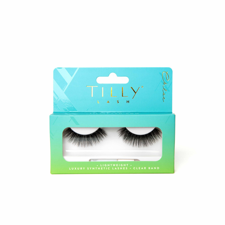 Faux mink eyelashes in a blue and green box sitting on a white background. 