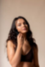 Model shot of tanning brush on a cream backdrop 